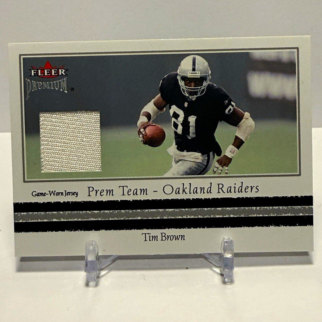 Fleer 2002 Premium Tim Brown Prem Team Jerseys MEM Insert #PR20 Raiders Fleer 2002 Premium Tim Brown Prem Team Jerseys MEM Insert #PR20 Raiders