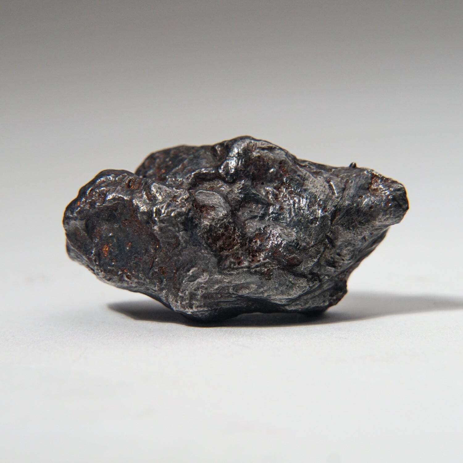 Genuine Sikhote-Alin Meteorite on Acrylic Stand (99.5 grams)