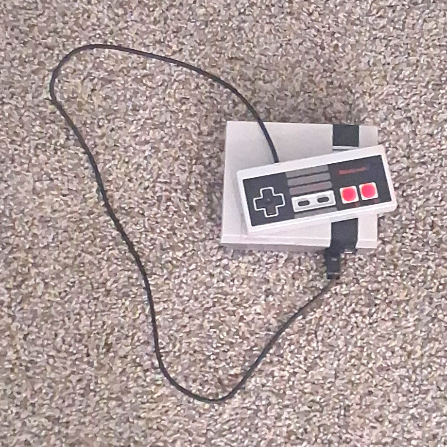 Nintendo Mini nes w/ Wired Controller NOT with cables (sorry) Nintendo Mini nes w/ Wired Controller NOT with cables (sorry)