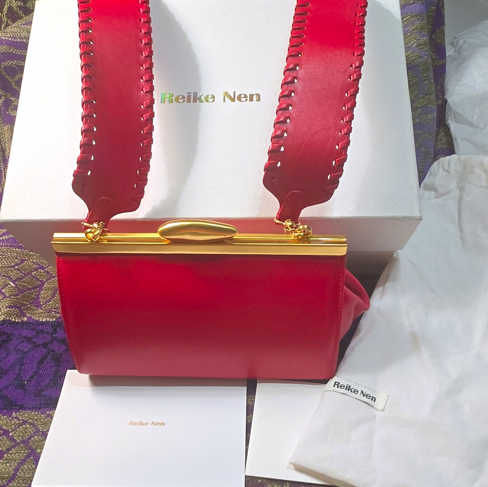 Reike Nen Leather, Red Kiss, Mini W/Detacheable Strap Clutch Gold Tone Accents Reike Nen Leather, Red Kiss, Mini W/Detacheable Strap Clutch Gold Tone Accents