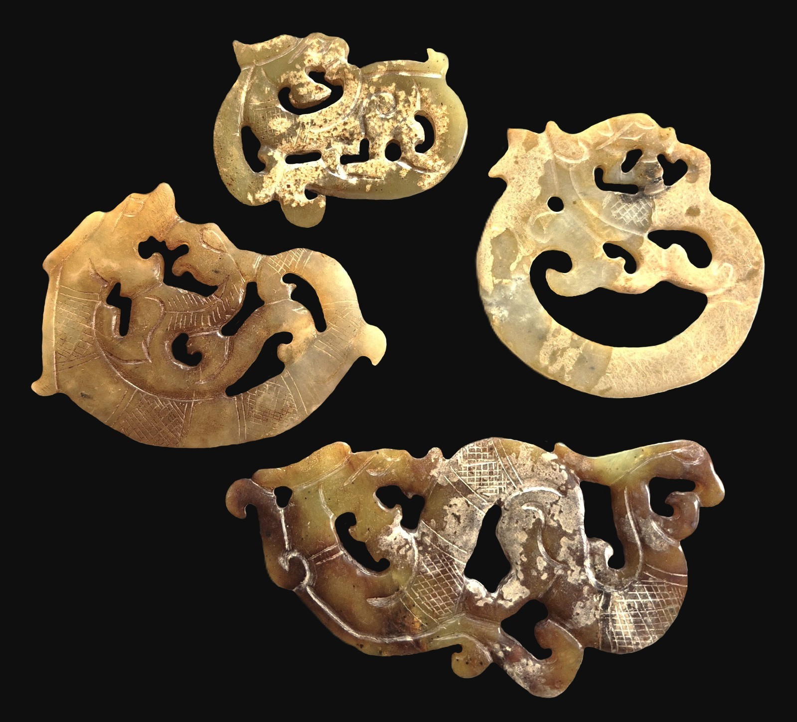 Collection of Four Fengshui Chinese Carved Jade Dragon Amulet Pendants Collection of Four Fengshui Chinese Carved Jade Dragon Amulet Pendants
