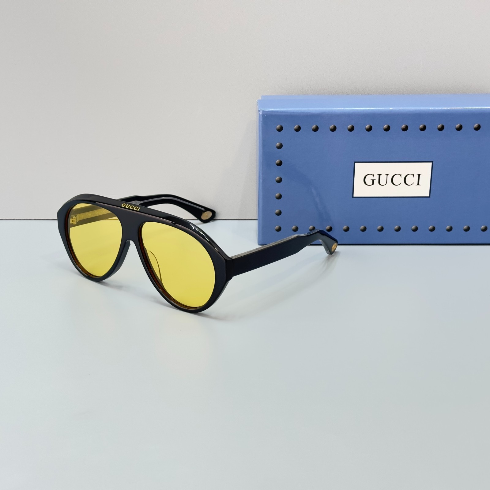 Gucci GG0479S Aviator Sunglasses Black Frame Yellow Lens Vintage Style