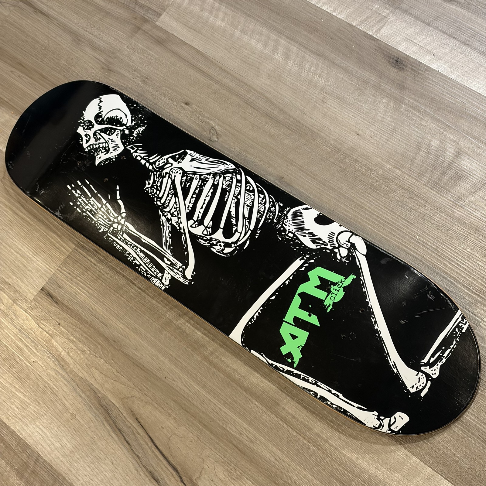 ATM Click Skateboard Deck Nevermind Praying Skeleton Graphic Black Purple