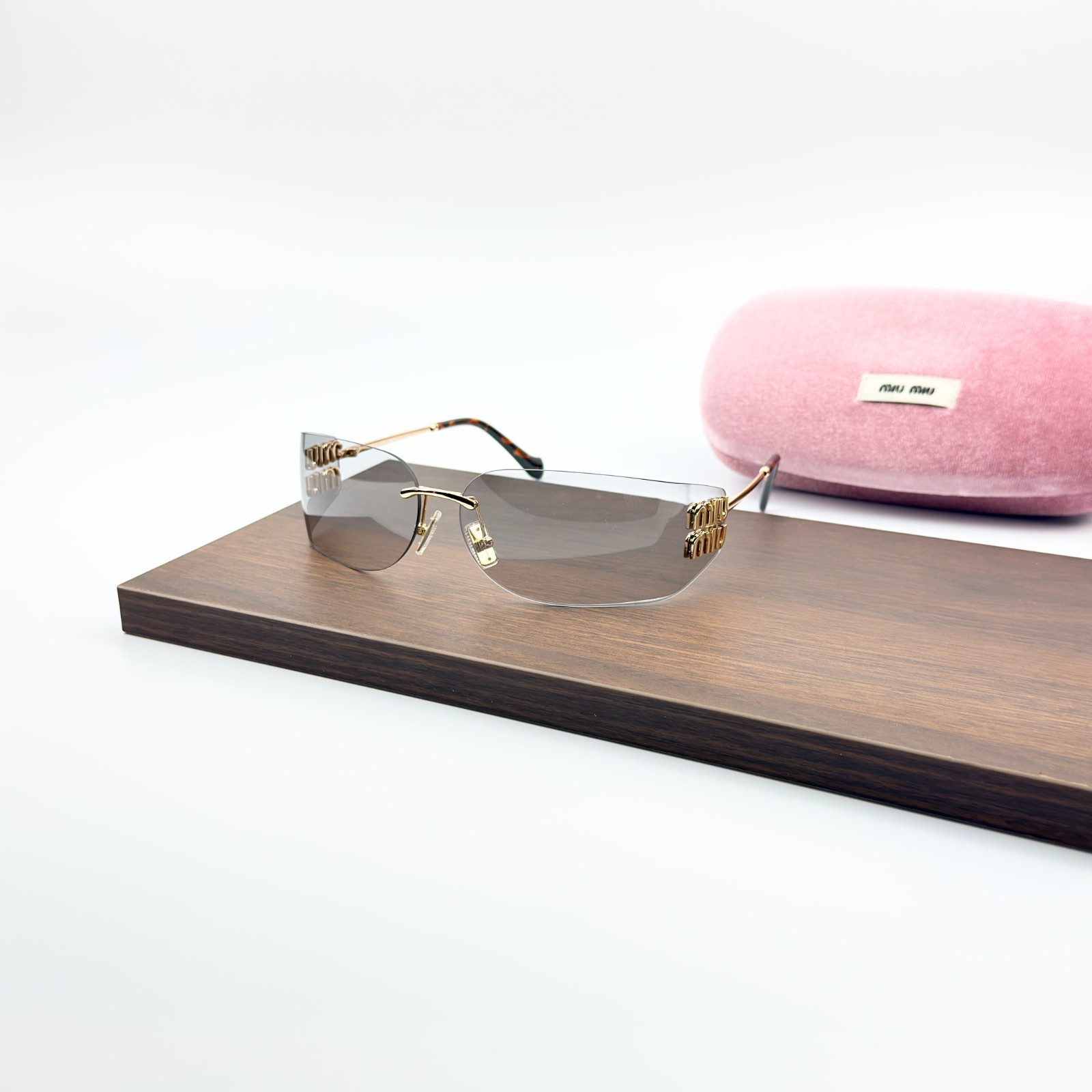 Miu Miu MU A51S Sunglasses Rimless Gold Frame Gray Lens Logo Designer Eyewear