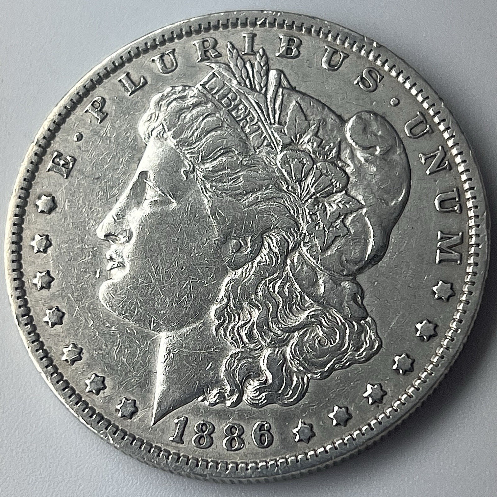 1886-O Morgan Silver Dollar Fine Condition 90% Silver 1886-O Morgan Silver Dollar Fine Condition 90% Silver