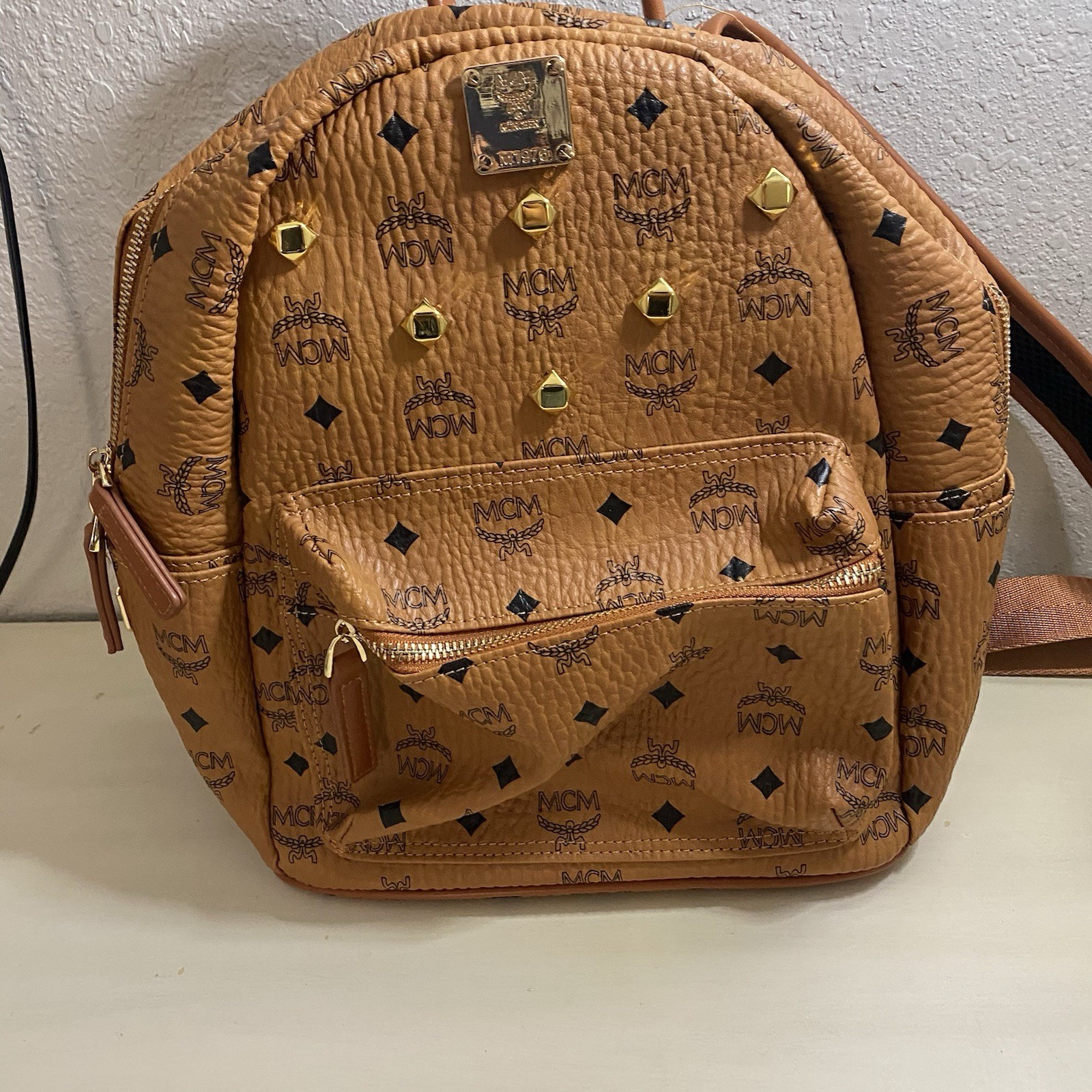 Authentic MCM Stark Visetos Backpack Cognac Monogram Gold Studded Medium Authentic MCM Stark Visetos Backpack Cognac Monogram Gold Studded Medium