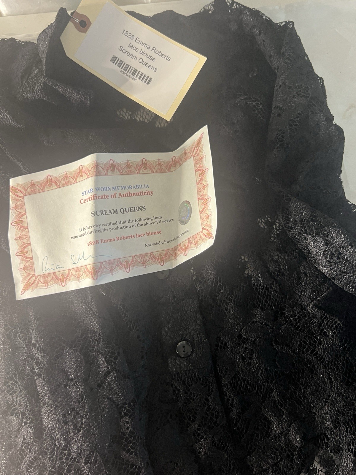 Emma Roberts black lace top worn in Scream Queen memorbilia