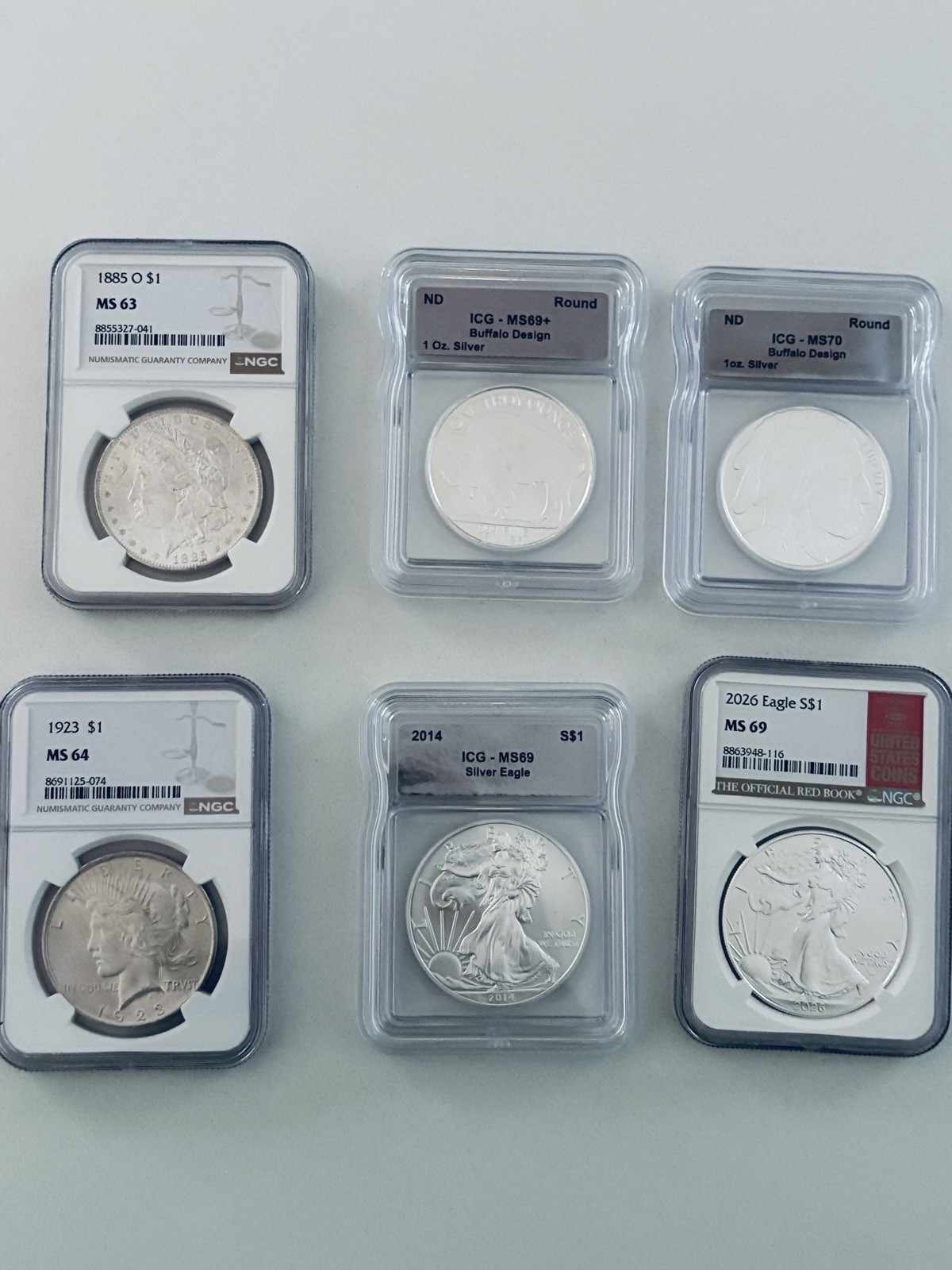 1885-O Morgan MS63, 1923 Peace MS64, 2014 +2026 ASE MS69, 2 Buffalo rounds 69+70 1885-O Morgan MS63, 1923 Peace MS64, 2014 +2026 ASE MS69, 2 Buffalo rounds 69+70
