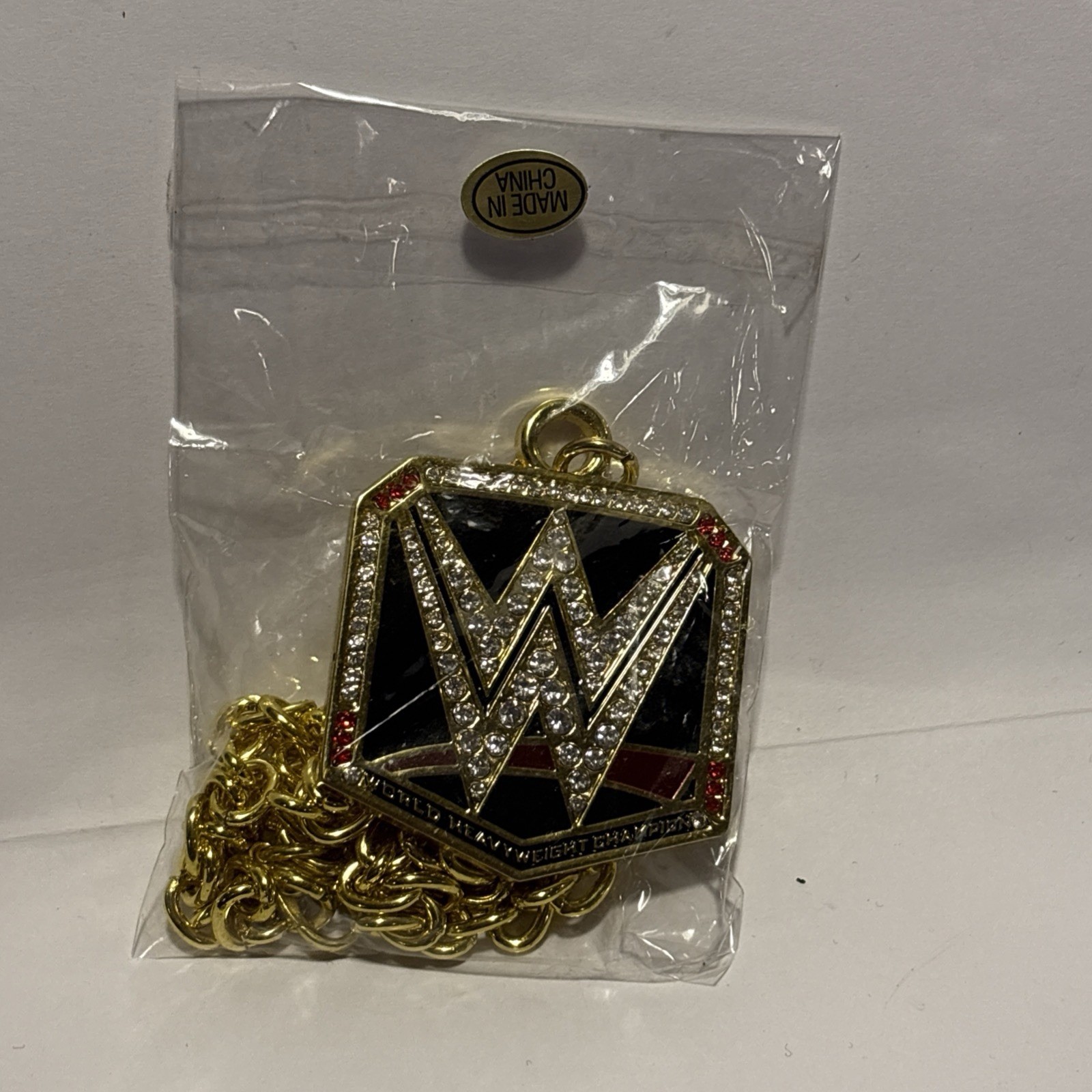 WWE Officially Licensed World Heavyweight Champion Logo Pendant Necklace Gold WWE Officially Licensed World Heavyweight Champion Logo Pendant Necklace Gold