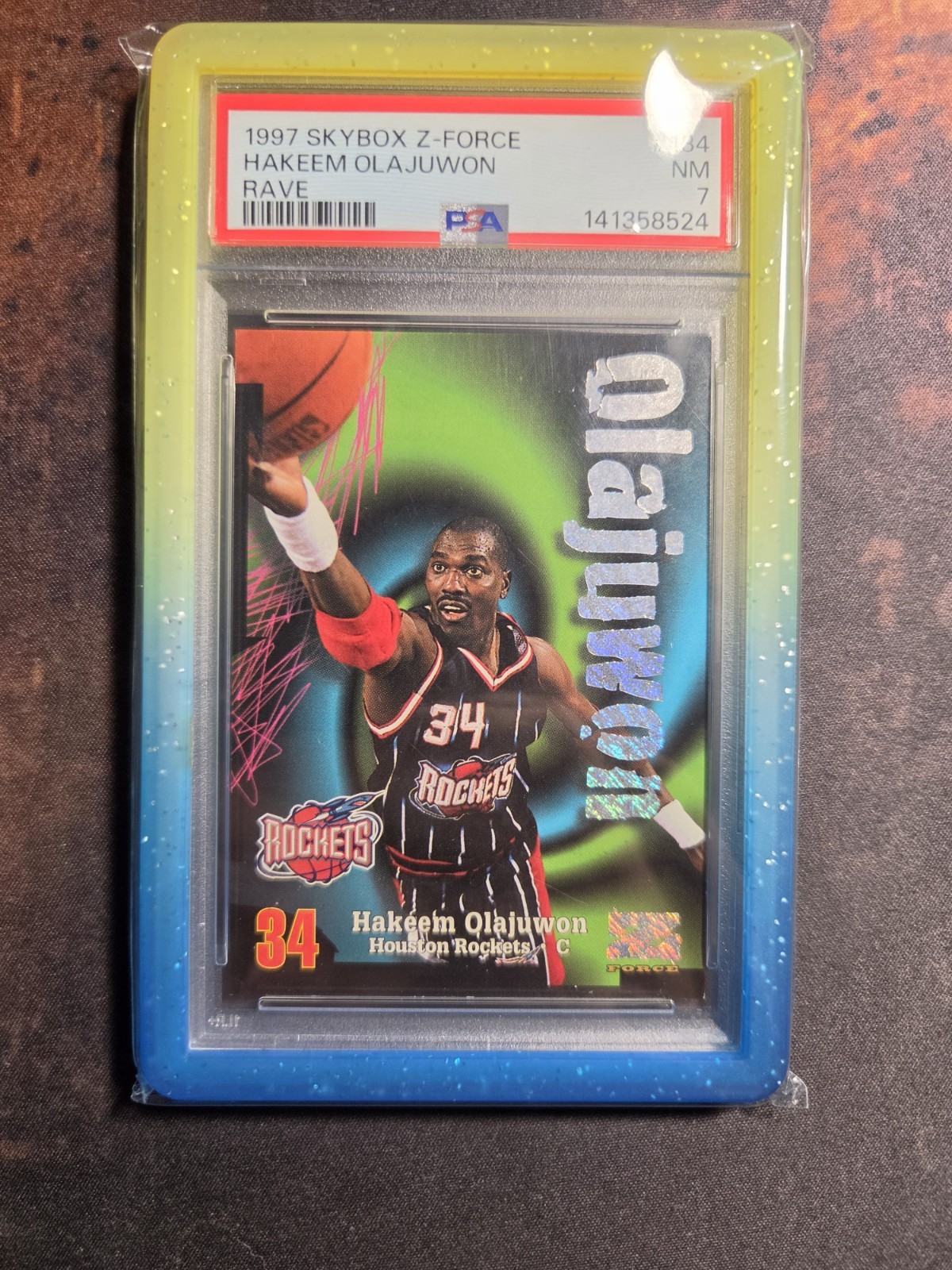 1997-98 Skybox Z-Force Rave #134 Hakeem Olajuwon Houston Rockets Rare /399 PSA 7 1997-98 Skybox Z-Force Rave #134 Hakeem Olajuwon Houston Rockets Rare /399 PSA 7