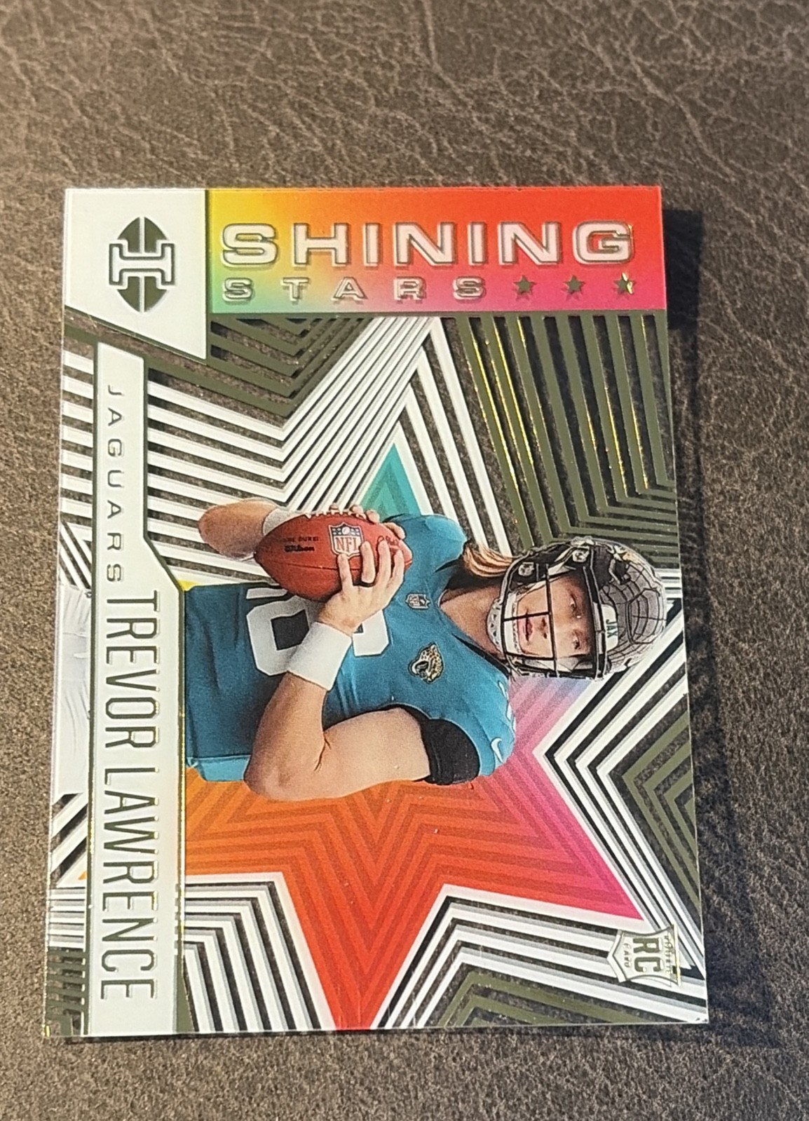 2021 Panini Illusions - Shining Stars Trevor Lawrence #SS-11 (RC) 2021 Panini Illusions - Shining Stars Trevor Lawrence #SS-11 (RC)