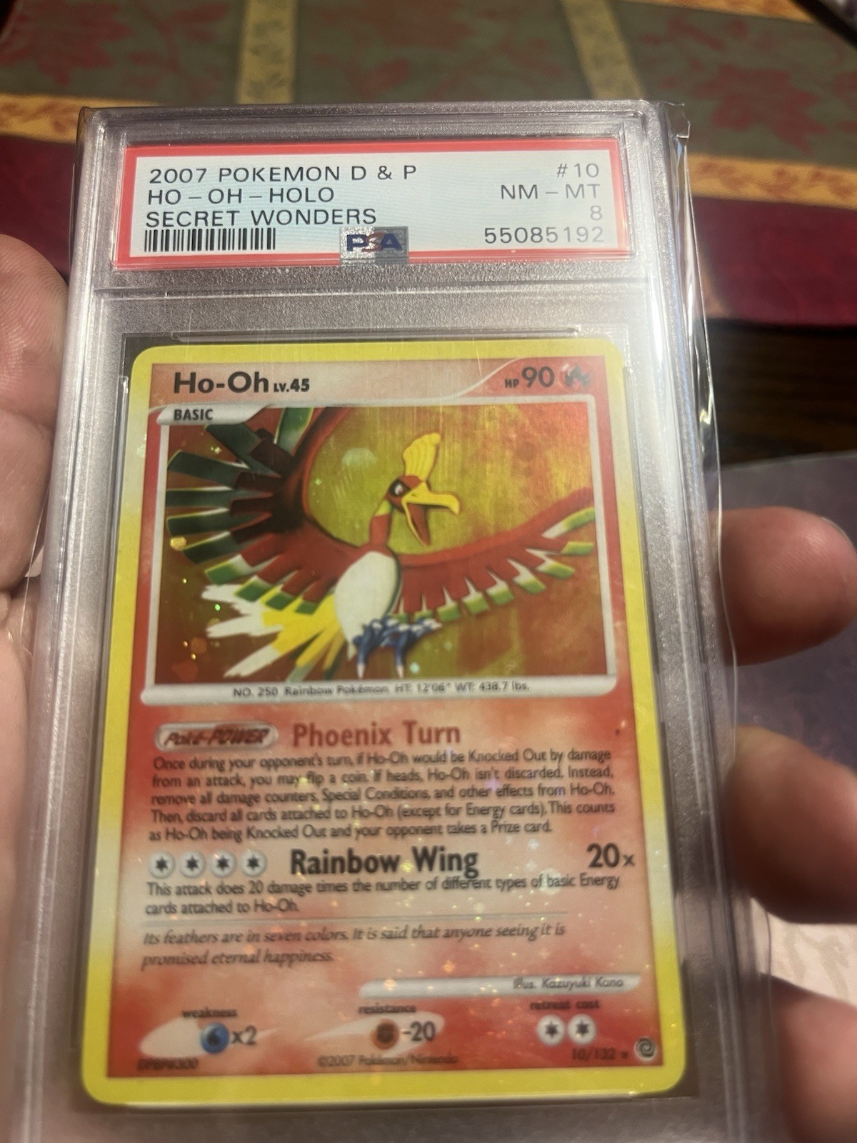 The Pokémon Company 2007 Pokemon TCG Secret Wonders Ho-Oh 10/132 Holo PSA 8