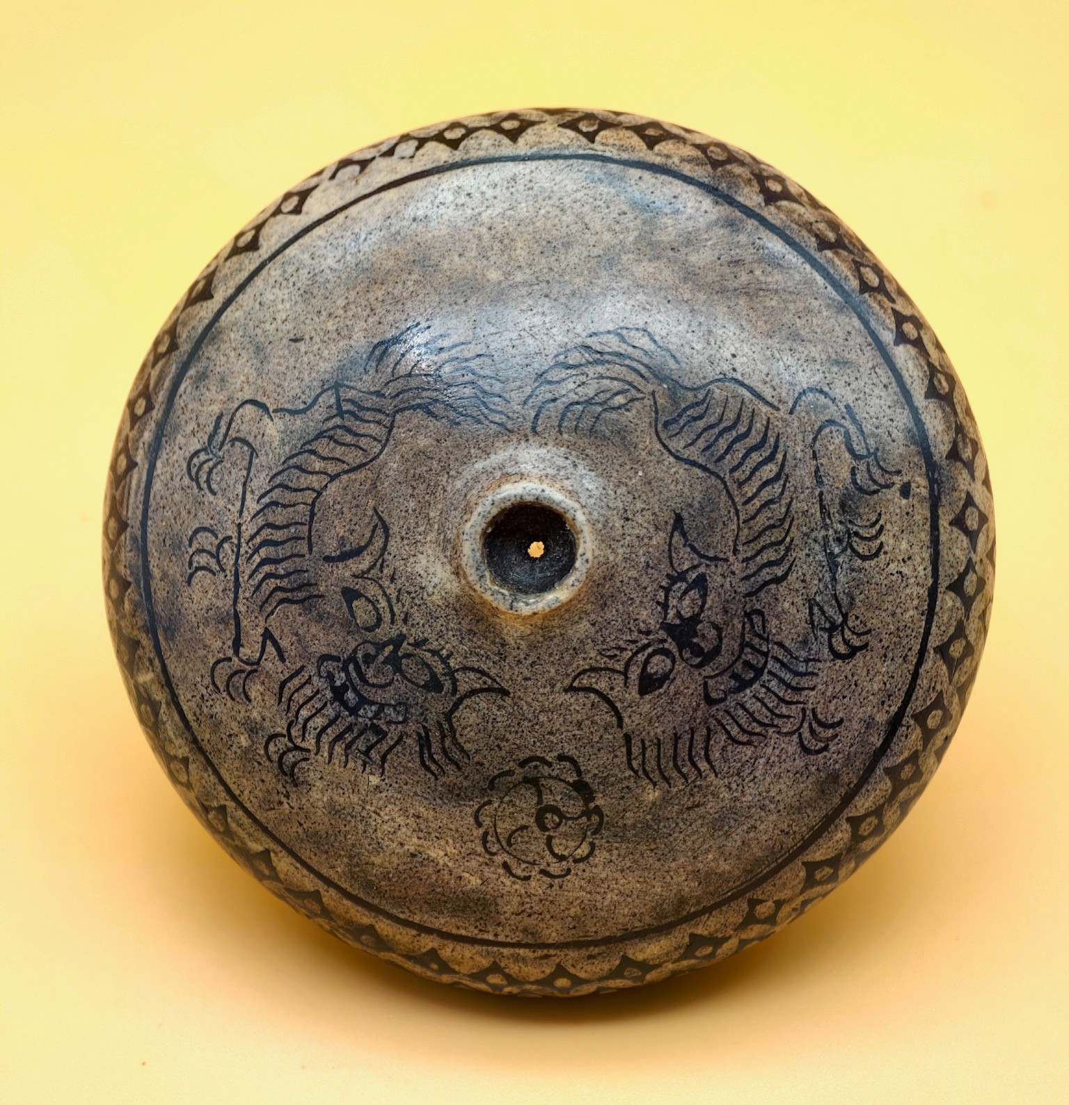 A rare antique Chinese grey round Yunnan opium bowl (damper) with fu dogs A rare antique Chinese grey round Yunnan opium bowl (damper) with fu dogs