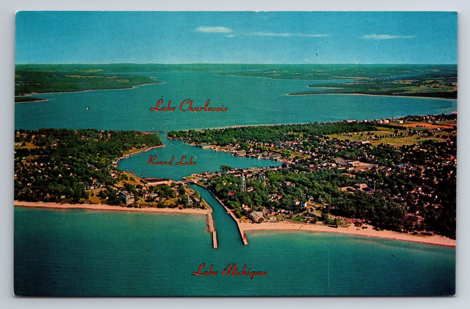 MI, Charlevoix-The-Beautiful the City on Tree Lakes Aerial View Vintage Postcard