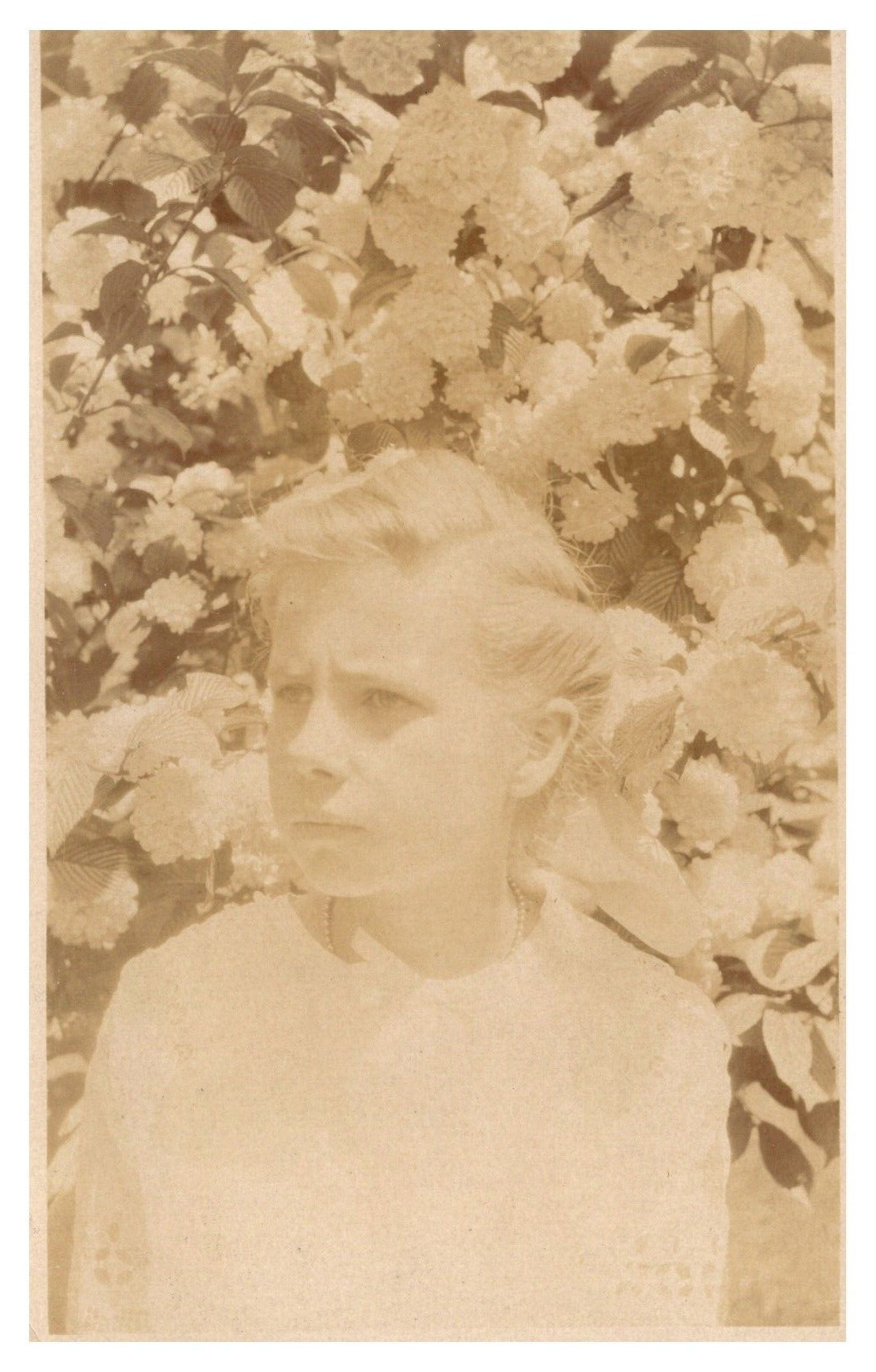 postcard Real Photo of woman in front of bloomed flowers 9966 postcard Real Photo of woman in front of bloomed flowers 9966