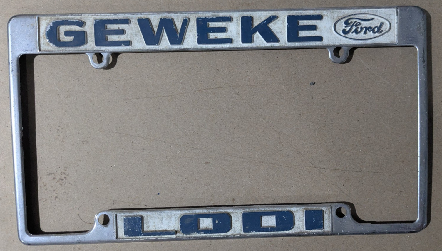 VTG Metal Geweke Lodi Embossed Ford Dealership License Plate Frame Gas & Oil VTG Metal Geweke Lodi Embossed Ford Dealership License Plate Frame Gas & Oil
