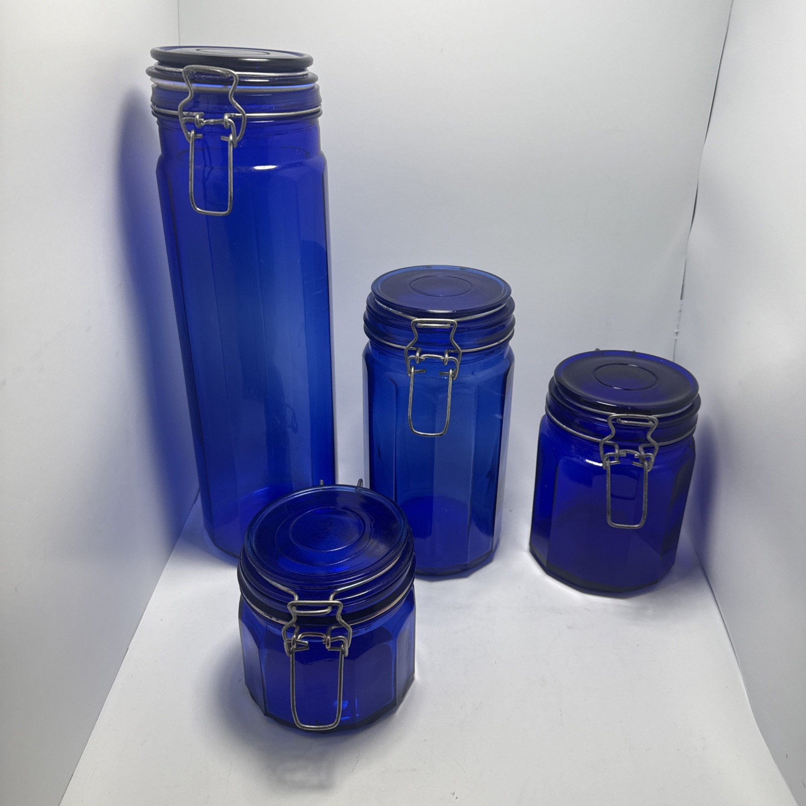 Vintage Set Cobalt Blue Glass 12 Panel Jar Wire Hinge Lid; 13” 8” 5.75” 4” Vintage Set Cobalt Blue Glass 12 Panel Jar Wire Hinge Lid; 13” 8” 5.75” 4”
