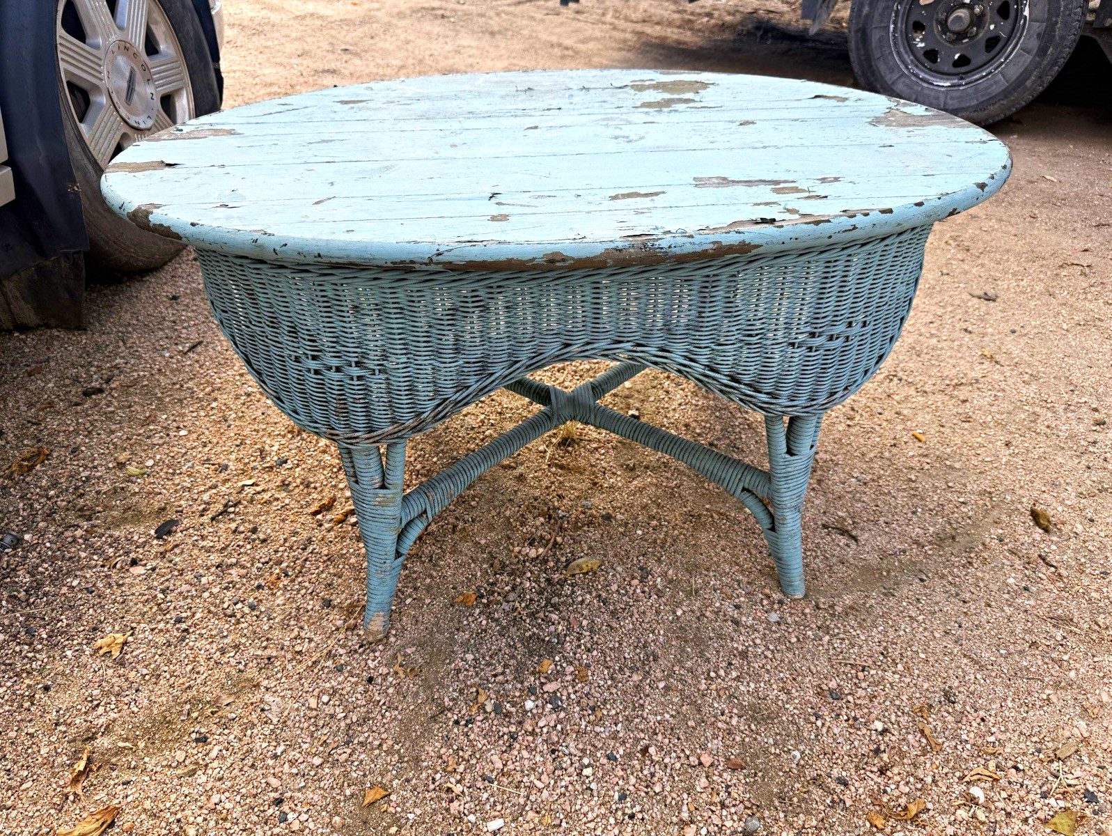 Vintage oval coffee table rustic weathered blue paint wood top woven wicker base Vintage oval coffee table rustic weathered blue paint wood top woven wicker base