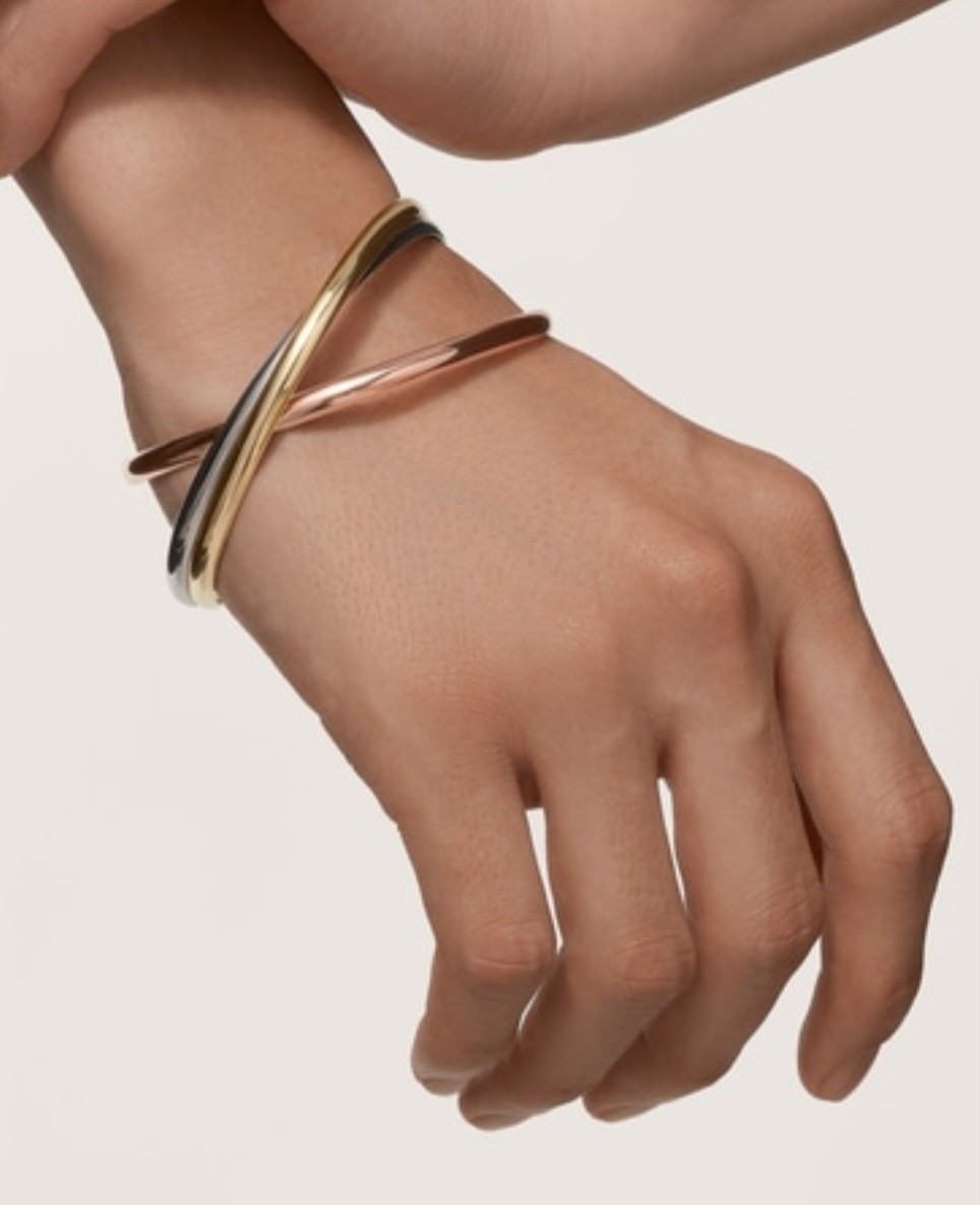 Cartier Trinity Bangle Bracelet. Crafted in 18k yellow, white & rose gold Cartier Trinity Bangle Bracelet. Crafted in 18k yellow, white & rose gold