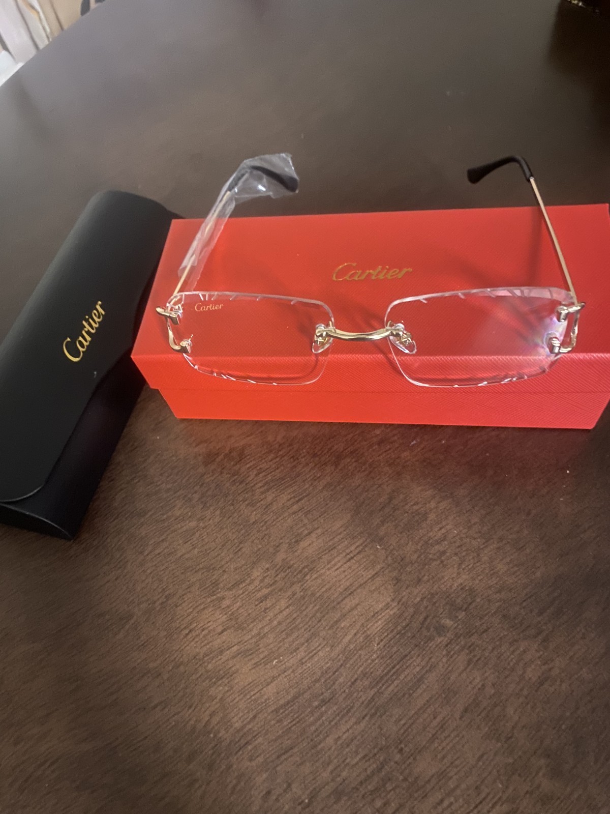 Cart.ier Classic C-Décor CT-00920 Rim less Eyeglasses – Gold / Brown Temples Cart.ier Classic C-Décor CT-00920 Rim less Eyeglasses – Gold / Brown Temples