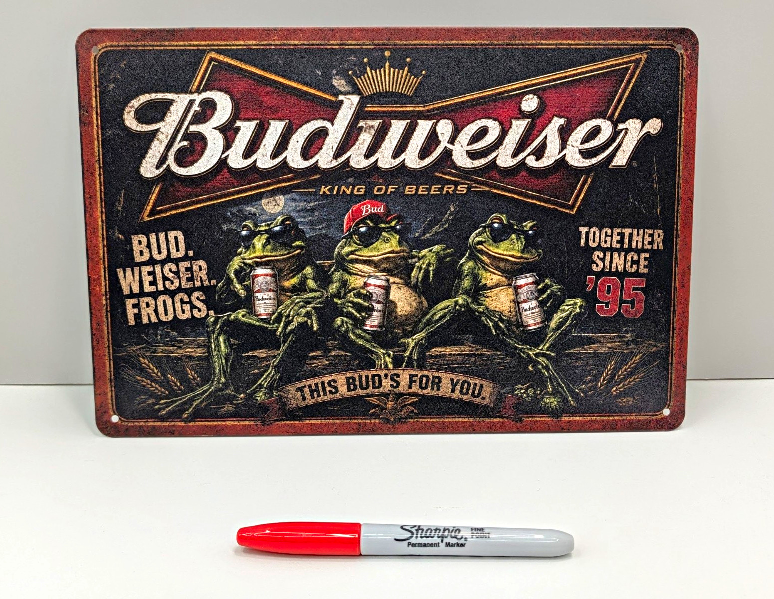 Budweiser Frogs Together Since '95 Tin Sign This Bud's For You. 12 in by 8 in Budweiser Frogs Together Since '95 Tin Sign This Bud's For You. 12 in by 8 in