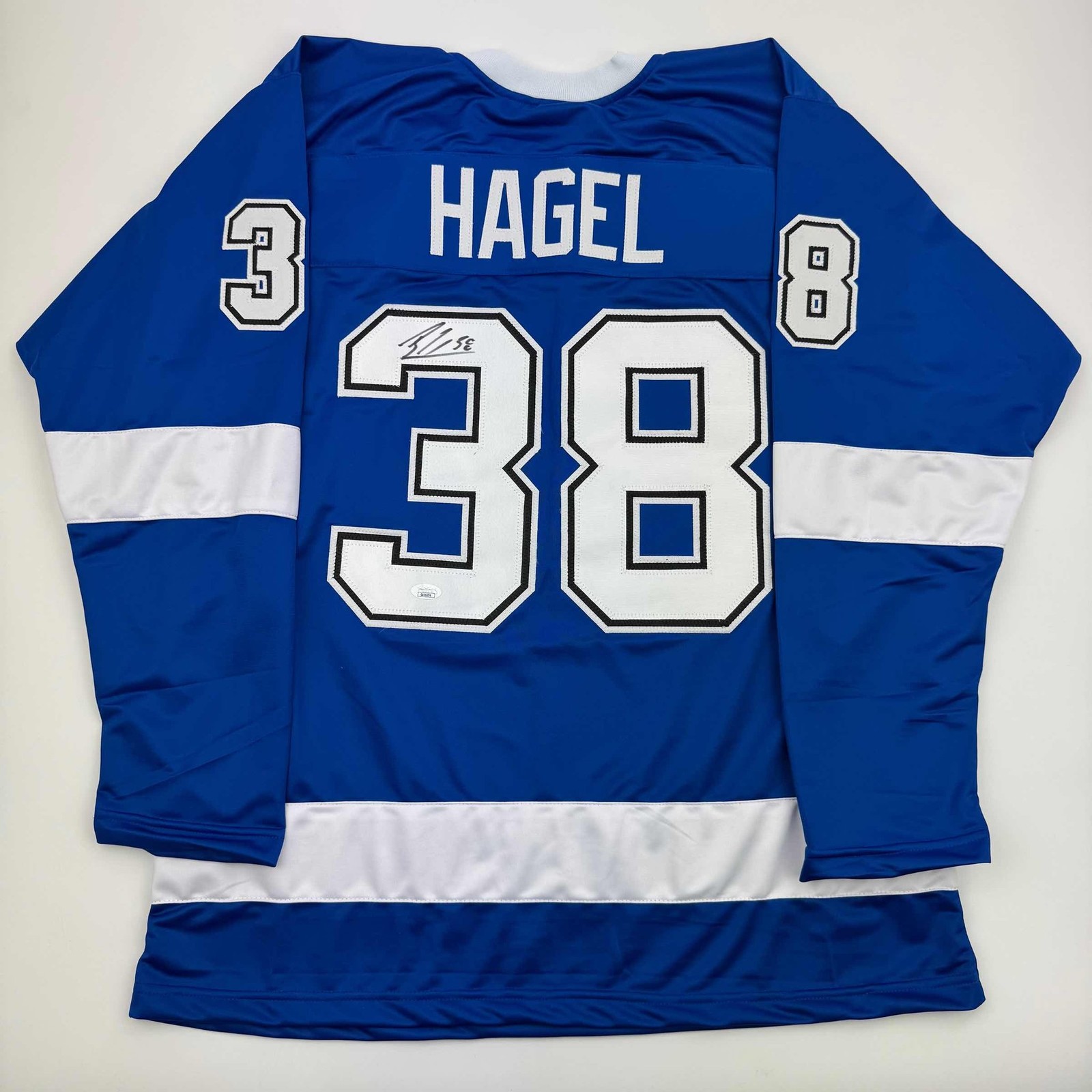 Autographed/Signed Brandon Hagel Tampa Bay Blue Hockey Jersey JSA COA Autographed/Signed Brandon Hagel Tampa Bay Blue Hockey Jersey JSA COA