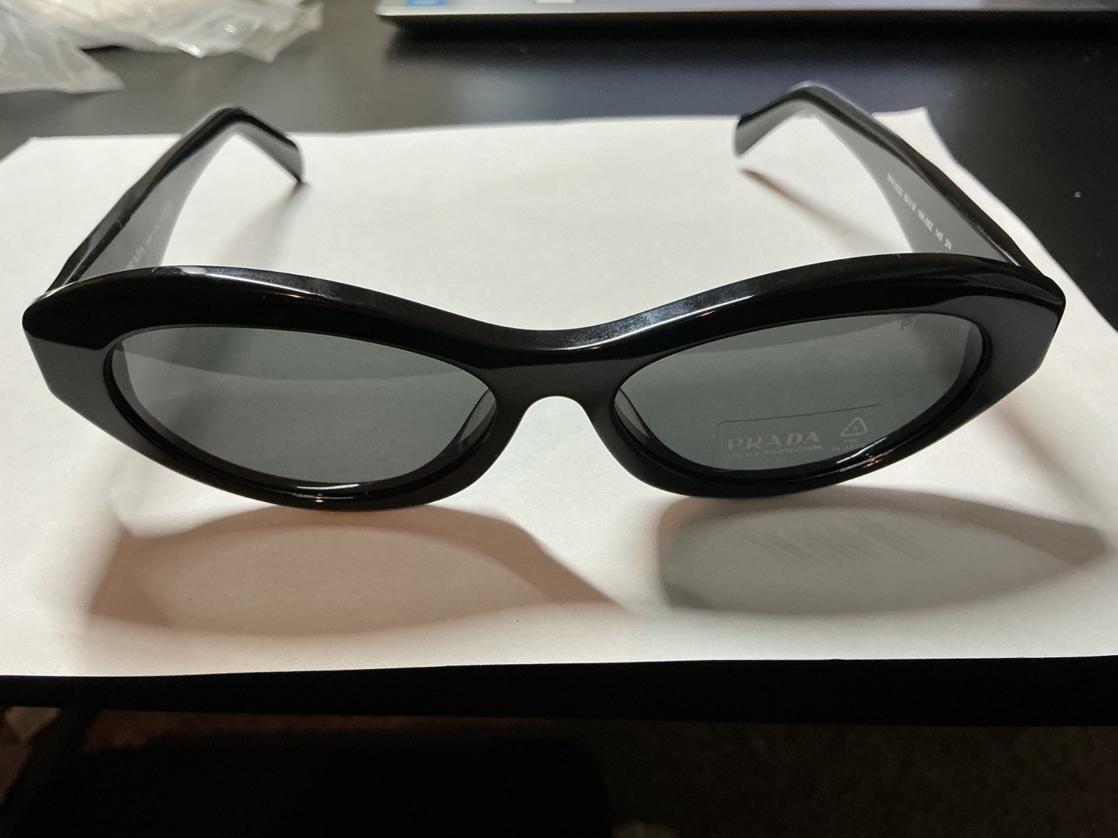 Prada PR 26ZS 16K08Z Women\'s Oval Sunglasses in Black with Gray Lens NEW