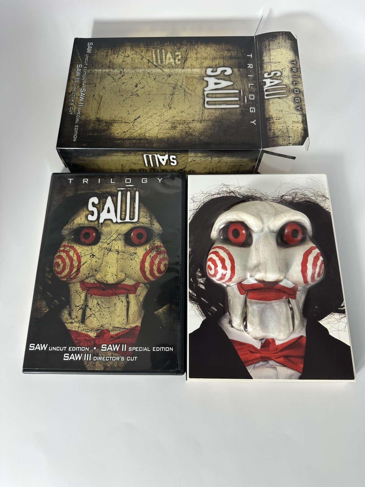 SAW Trilogy DVD Set SAW Uncut Edition- SAW II Special Ed.- SAW III Directors USA SAW Trilogy DVD Set SAW Uncut Edition- SAW II Special Ed.- SAW III Directors USA