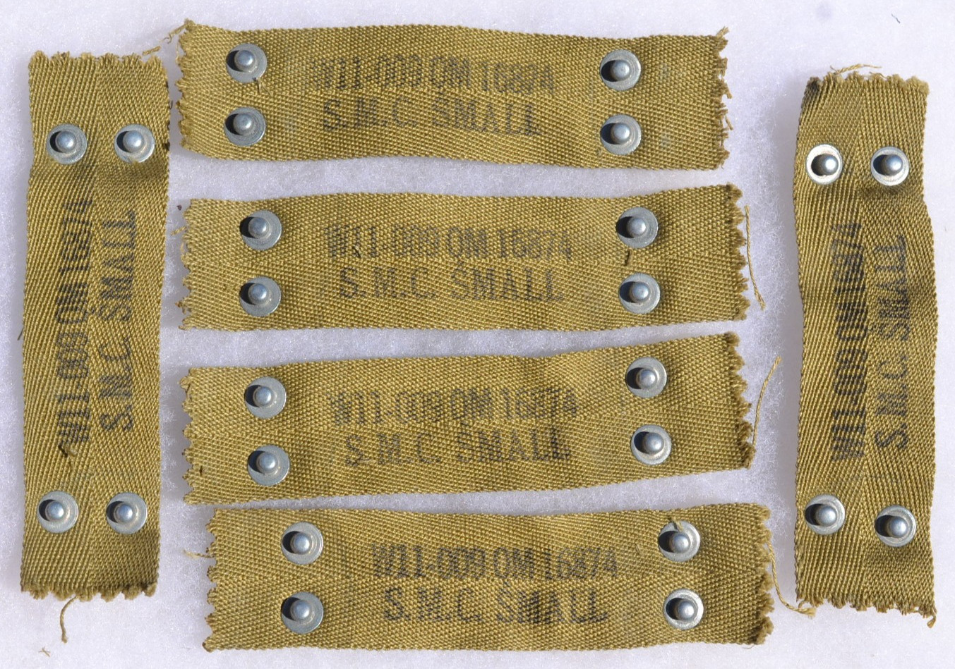 ORIGINAL WW2 US ARMY M-1 HELMET LINER NAPE STRAP S.M.C. MAKER STAMP 4.5 INCHES ORIGINAL WW2 US ARMY M-1 HELMET LINER NAPE STRAP S.M.C. MAKER STAMP 4.5 INCHES