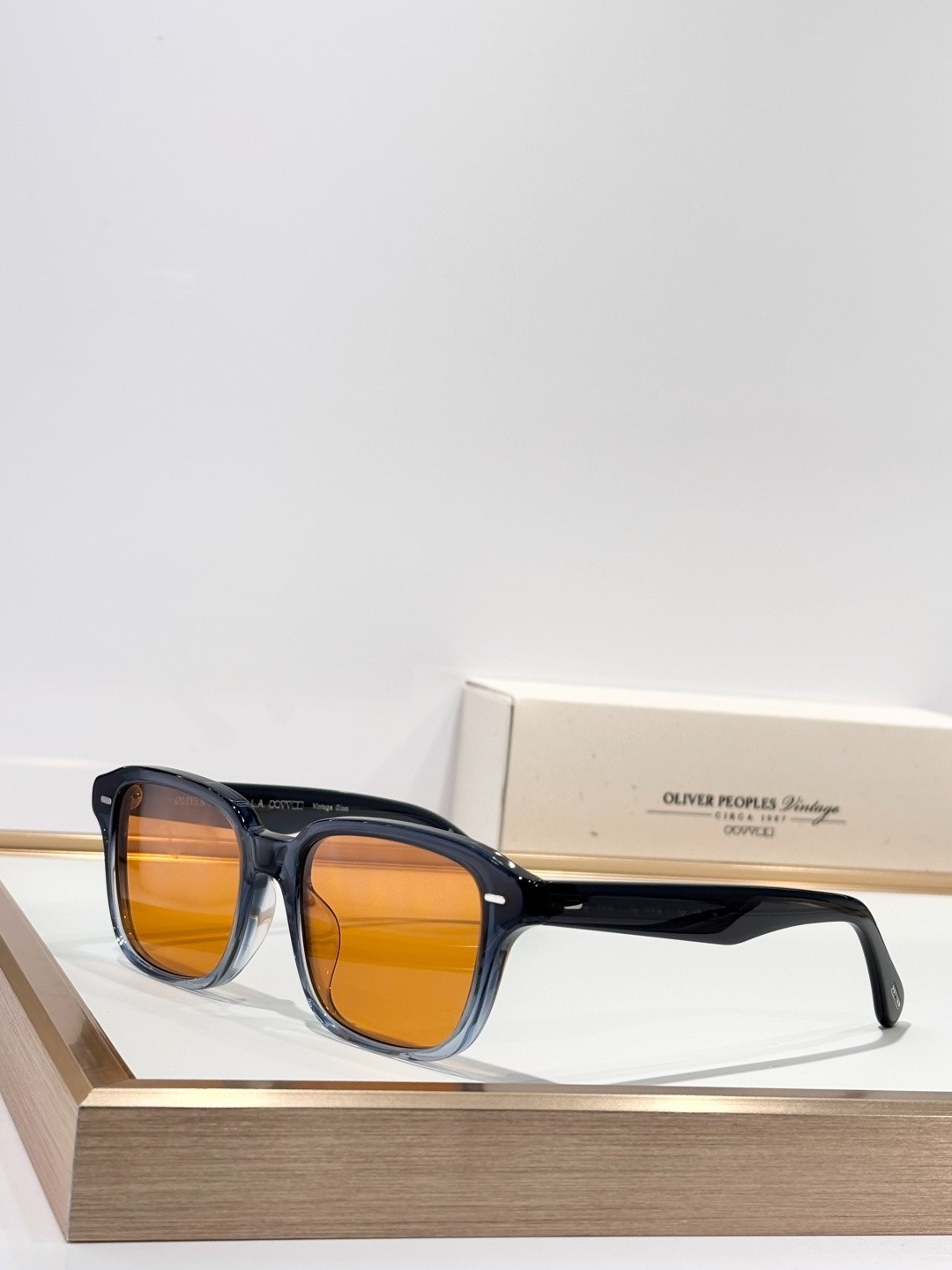 Oliver Peoples OV5562SU Sunglasses Square Blue Gradient Frame Orange Lens Oliver Peoples OV5562SU Sunglasses Square Blue Gradient Frame Orange Lens