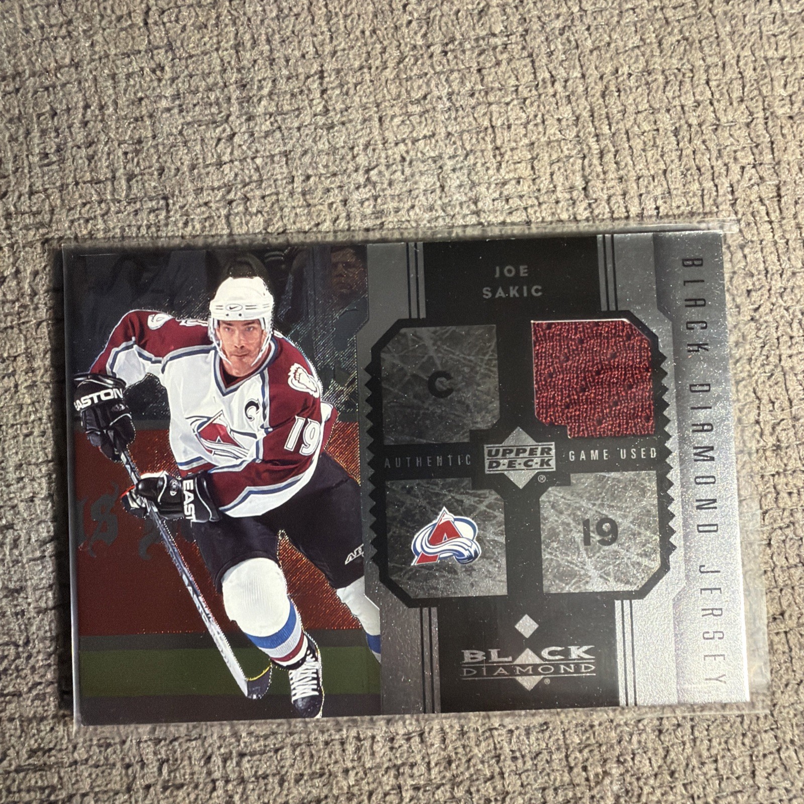 Joe Sakic 2005-06 Upper Deck Black Diamond Jersey Insert Card # JJS Joe Sakic 2005-06 Upper Deck Black Diamond Jersey Insert Card # JJS