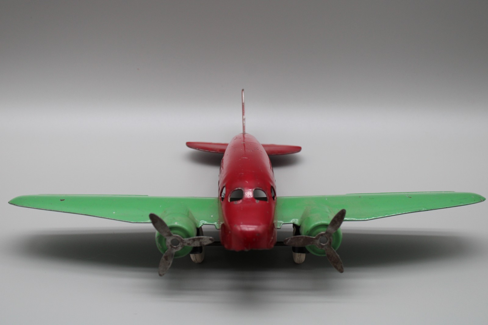 Vintage 1930s Diecast Metal Airplane Red Green Hubley Barclay Style Wooden Wheel Vintage 1930s Diecast Metal Airplane Red Green Hubley Barclay Style Wooden Wheel