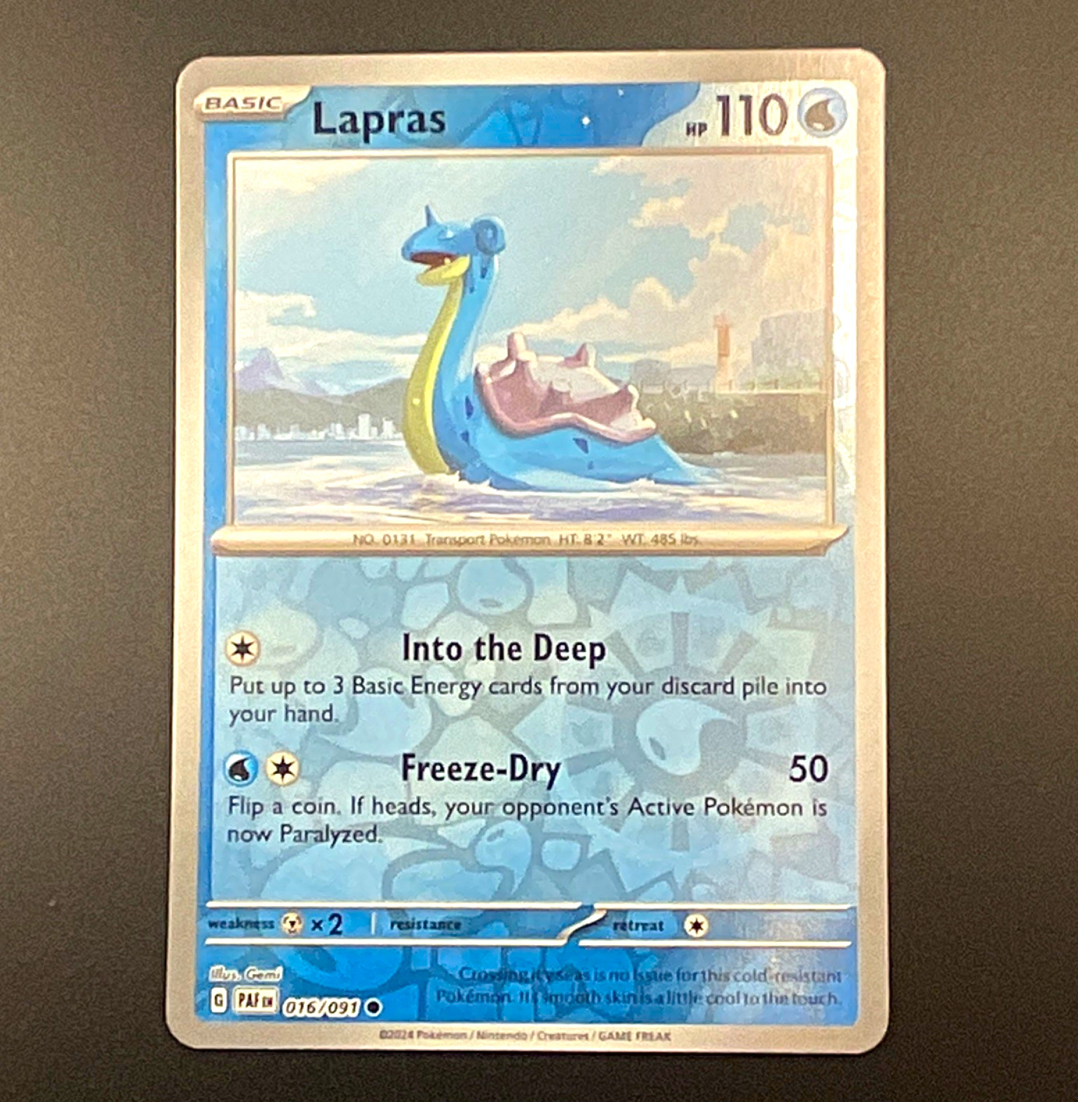 Lapras 016/091 SV: Paldean Fates Reverse Holo Common (English) Lapras 016/091 SV: Paldean Fates Reverse Holo Common (English)