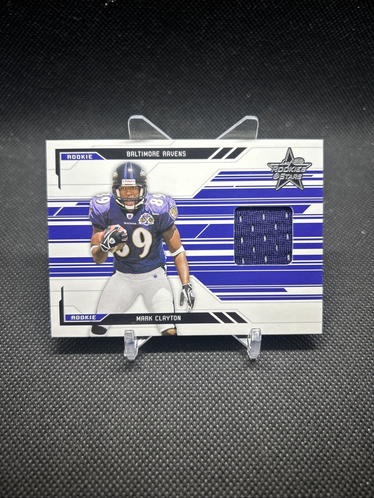 2005 Leaf Rookies & Stars Football Rookie /750 Mark Claytonevent work patch #266 2005 Leaf Rookies & Stars Football Rookie /750 Mark Claytonevent work patch #266