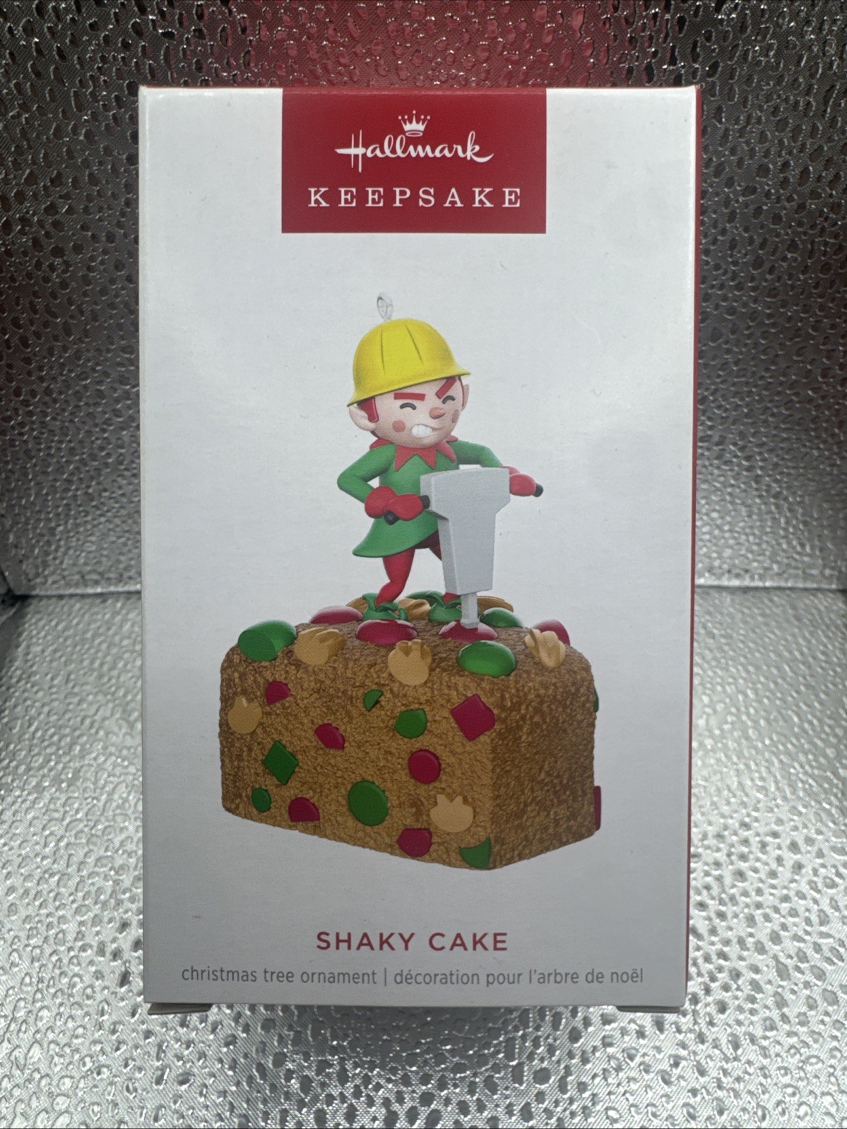 2024 Hallmark Shaky Cake Elf Jackhammer Fruitcake Keepsake Magic Ornament NEW
