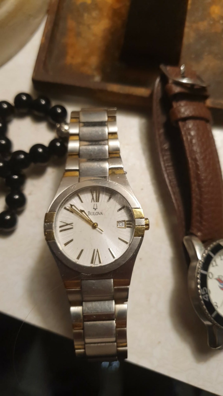 Bulova Quartz Analog White Dial Roman Numerals Date Two-Tone Bracelet Bulova Quartz Analog White Dial Roman Numerals Date Two-Tone Bracelet
