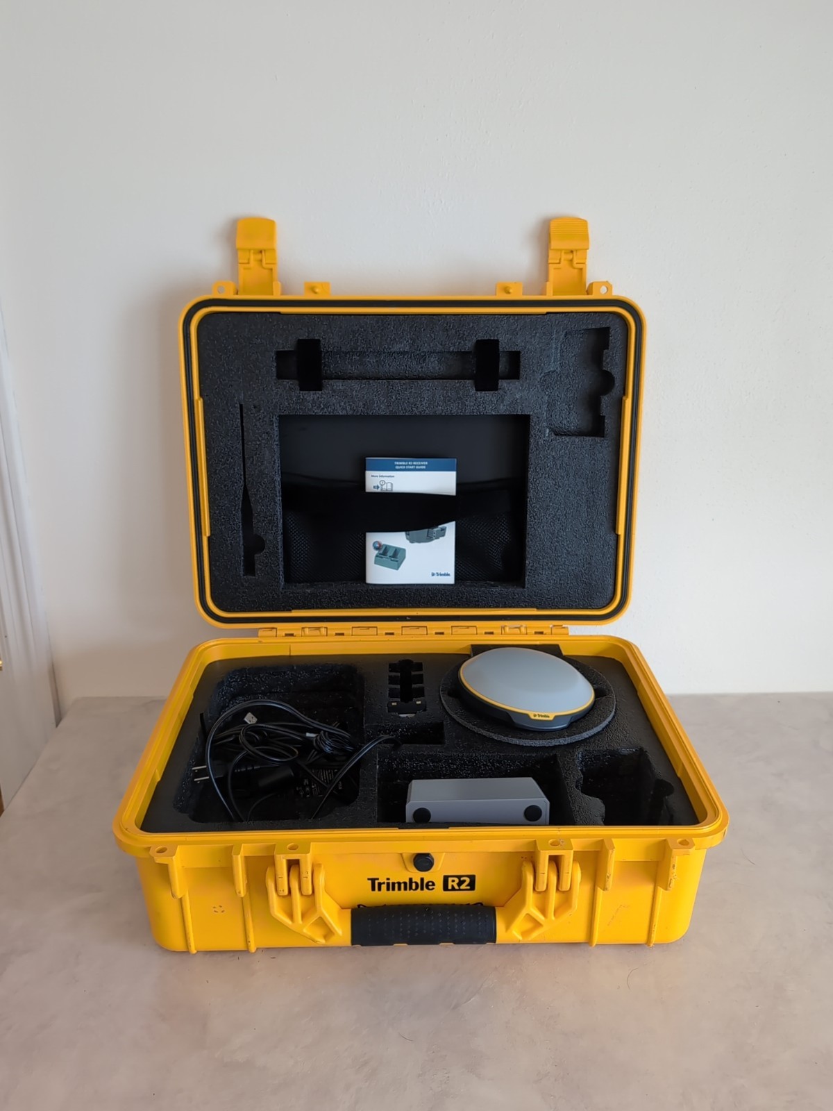 TRIMBLE R2 GNSS Receiver, Battery Charger, Antenna, And USB Cord TRIMBLE R2 GNSS Receiver, Battery Charger, Antenna, And USB Cord