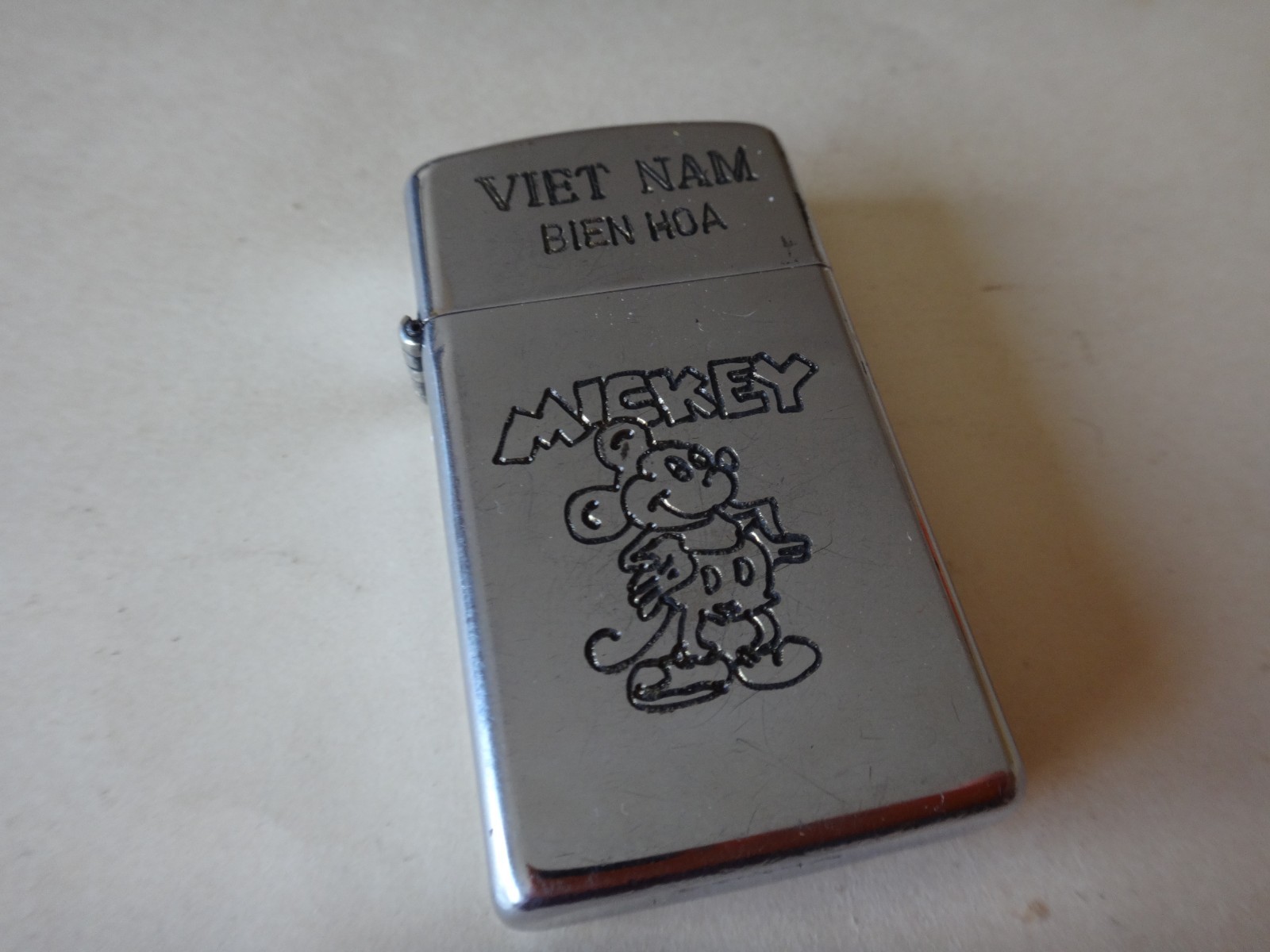Year 1981 Zippo Slim Lighter VIETNAM BIEN HOA, MICKEY MOUSE and Iconic Phrase