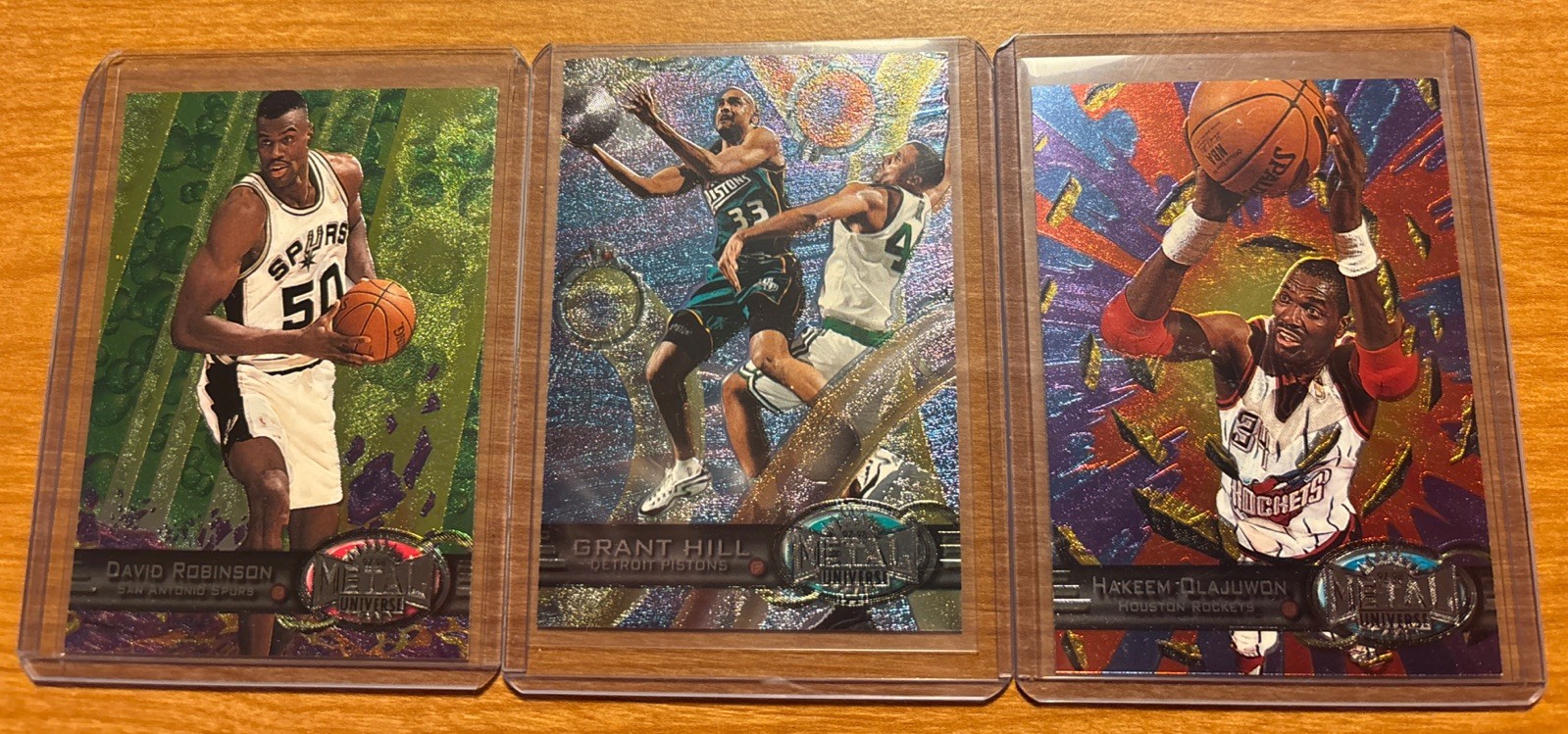 1997-98 Metal Universe Hakeem Olajuwon David Robinson Grant Hill 1997-98 Metal Universe Hakeem Olajuwon David Robinson Grant Hill
