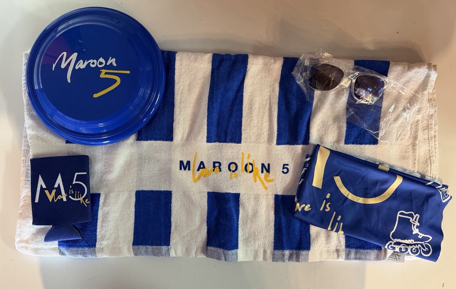 Maroon 5 Love Is Like Beach Towel Sunglasses & More Promo Maroon 5 Love Is Like Beach Towel Sunglasses & More Promo