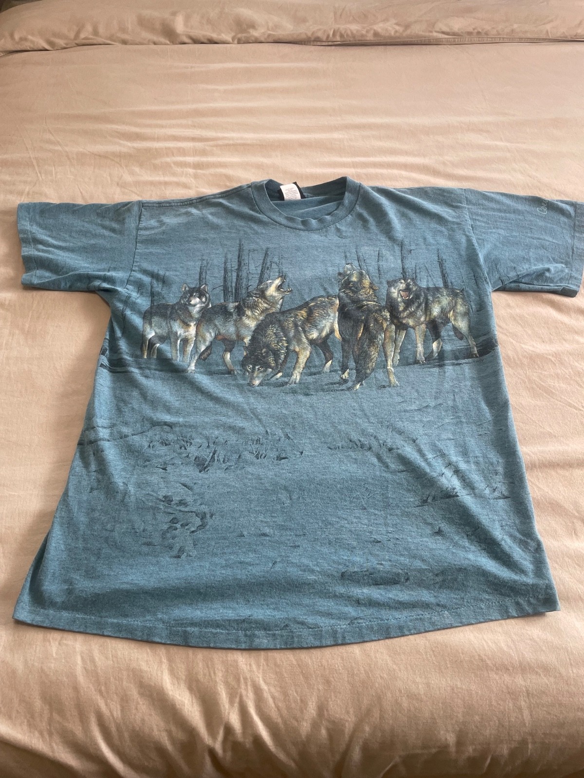 a vintage 1990s all-over print (AOP) wolf pack t-shirt a vintage 1990s all-over print (AOP) wolf pack t-shirt