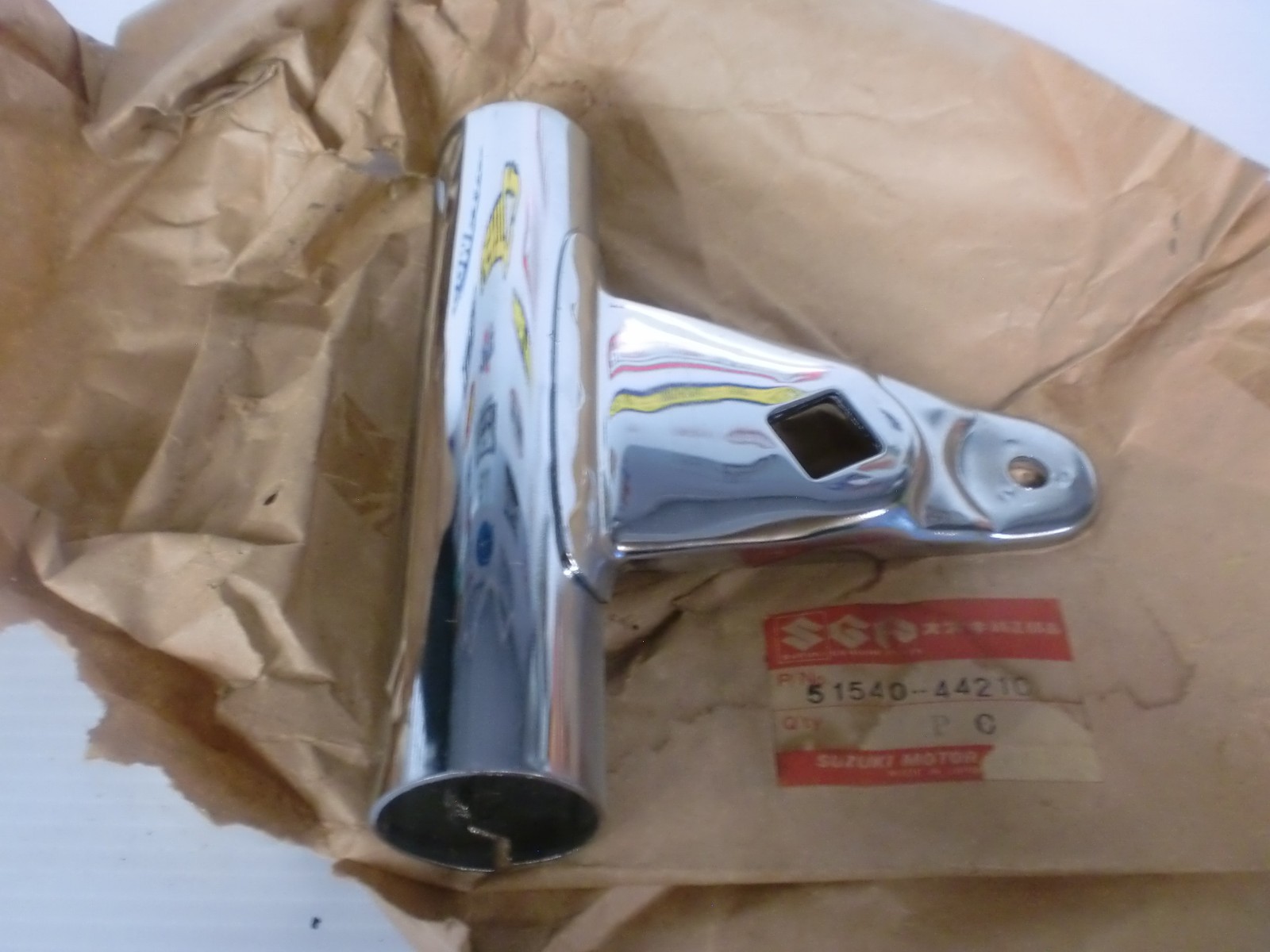 NOS Suzuki Head Lamp Bracket NOS Suzuki Head Lamp Bracket