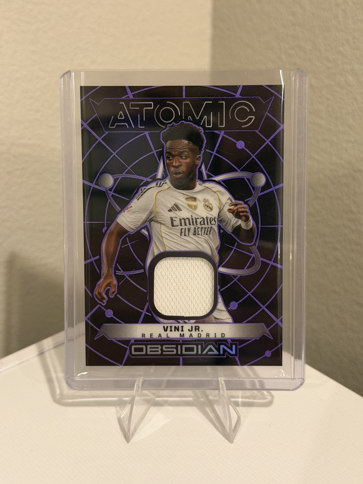Vini Jr 2025-26 Panini Obsidian Atomic Patch Electric Purple /99 Real Madrid Vini Jr 2025-26 Panini Obsidian Atomic Patch Electric Purple /99 Real Madrid