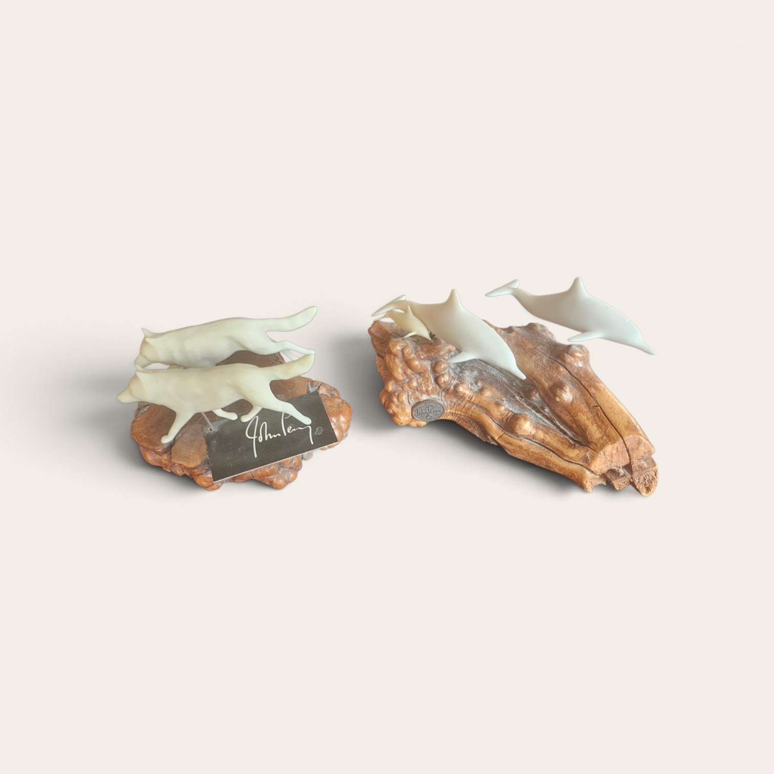 John Perry sculptures: 1 – Wolfpack, 2 – Dolphins