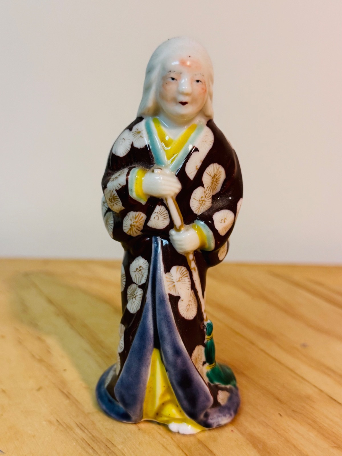 Vintage Japanese Kutani Porcelain Figurine of Classic Character holding a Broom Vintage Japanese Kutani Porcelain Figurine of Classic Character holding a Broom