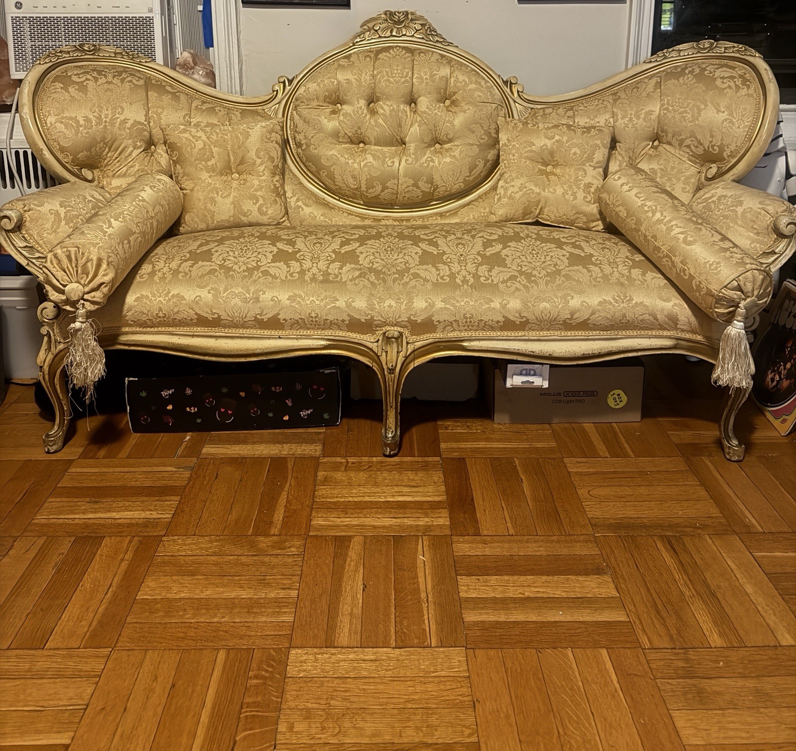 Rare Vintage French-inspired vintage gold damask sofa with a carved gilded frame Rare Vintage French-inspired vintage gold damask sofa with a carved gilded frame