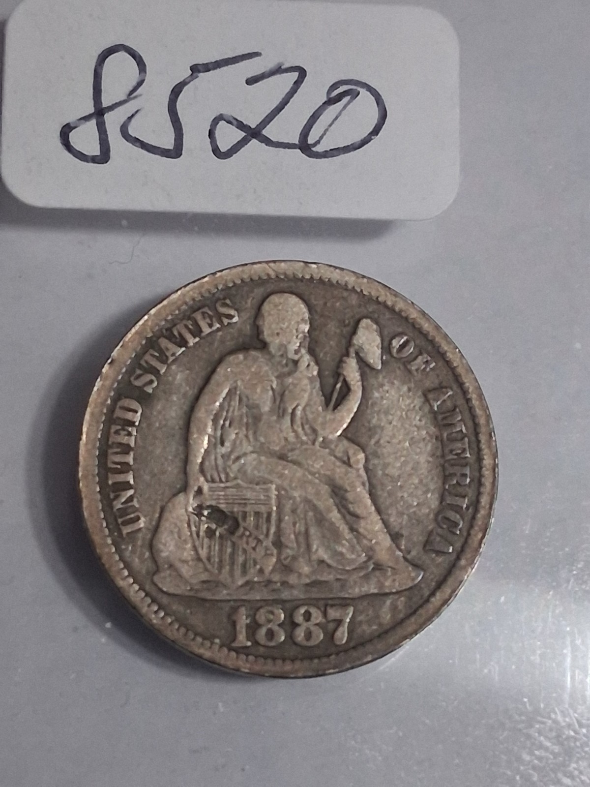 1887 S SEATED LIBERTY DIME - PLEASE NOTE THAT THERE IS A SMALL DENT ON SHIELD -