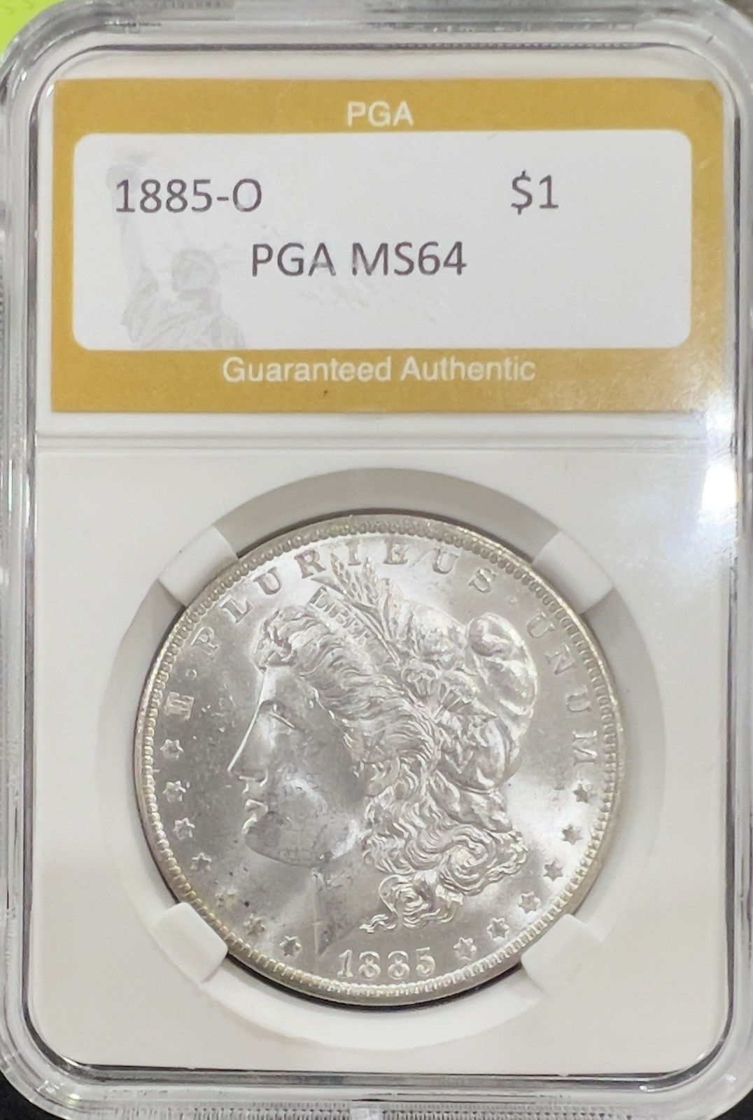 1885-O Morgan Silver dollar PGA SLABBED MINT 64 1885-O Morgan Silver dollar PGA SLABBED MINT 64