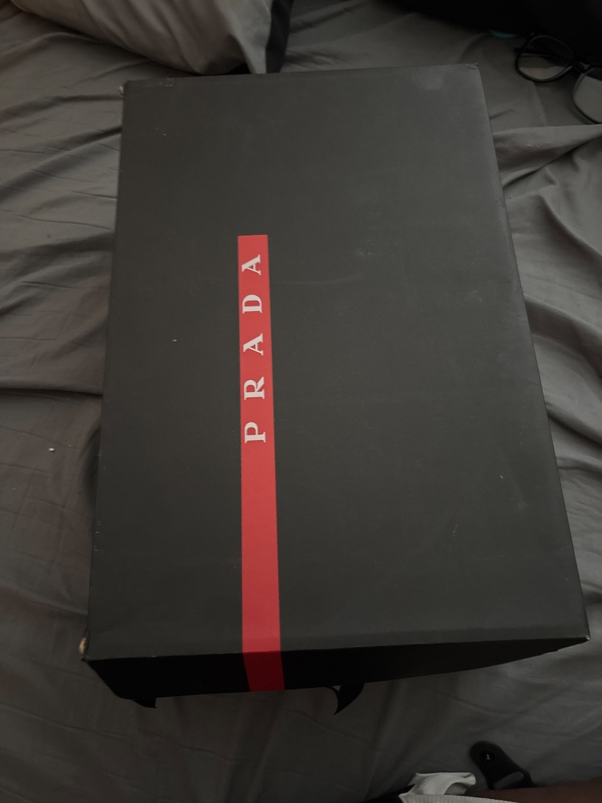 White and a light gray Prada shoes