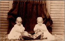 Postcard Real Photo RPPC Children Sitting on Floor Looking Through Photo Book picture